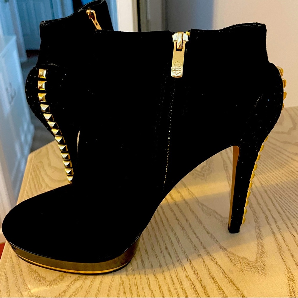 Black booties with gold stud heel